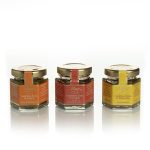 Set of strawberry, orange and apricot selected jams